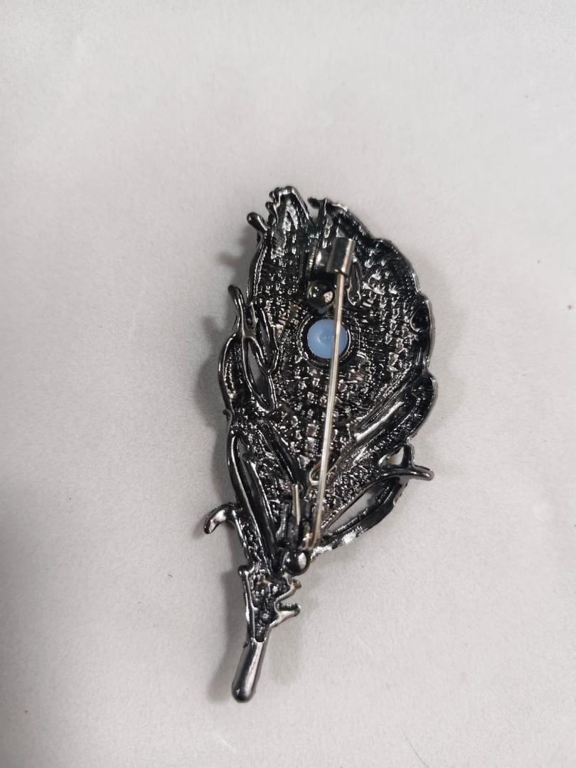 Imported premiun peacock feather brooch  multi stone work
